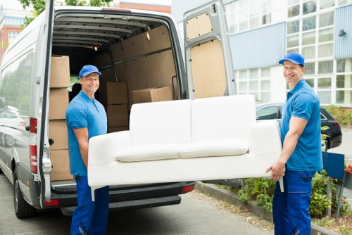 Professional packing team organizing items in Bow