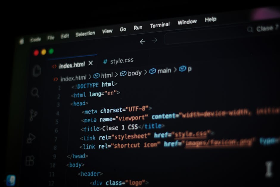 A computer screen displaying lines of HTML code with syntax highlighting, showing a typical webpage structure including meta tags, a title labeled 'Clase 1 CSS,' and linked stylesheet and icon files. 